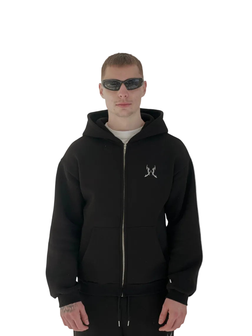 Person wearing a black hoodie with a logo on a white background