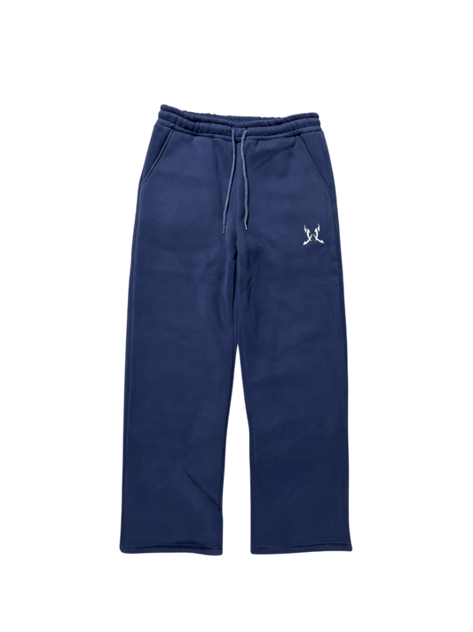 Navy blue sweatpants with a small white logo on a white background